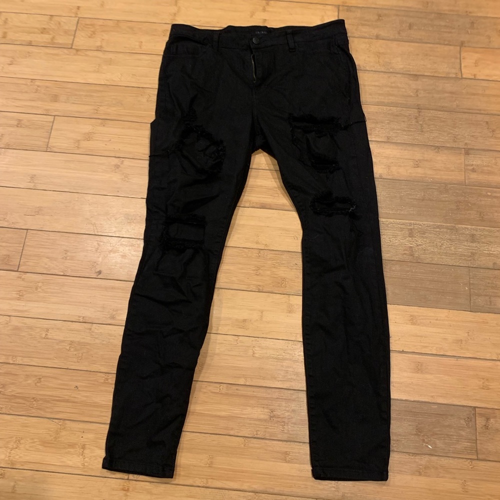 Women’s destressed black jeans